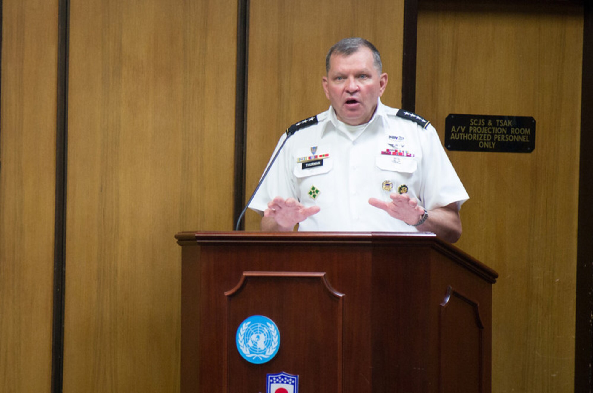 Gen. James D. Thurman, United Nations Command, Combined Forces Command and United States Forces Korea commander, presents awards to civilians and service members in recognition of their contributions in time in an effort to build strong bonds between the Korean people and service members of USFK on United States Army Garrison Yongsan, Republic of Korea, Sep. 23, 2013. (U.S. Army Photo/Sgt. Brian Gibbons)