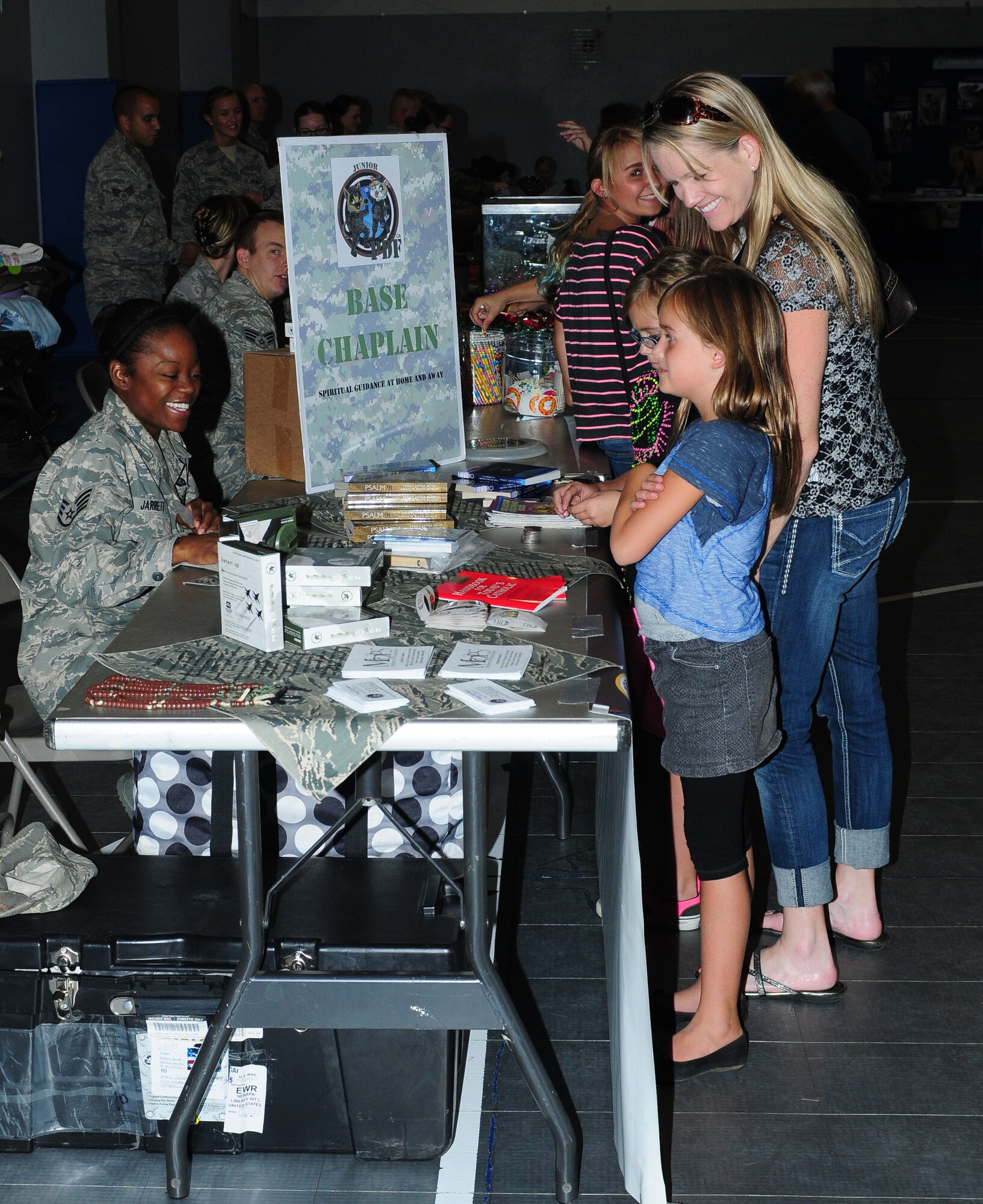 Beale youth participate in a Jr. Personnel Deployment Function Line at the Youth Center on Beale Air Force Base, Calif., Sept. 20, 2013. Children interacted with Airmen to simulate a deployment line, including receiving orders and getting fitted in protective gear. (U.S. Air Force photo by Senior Airman Allen Pollard/Released)