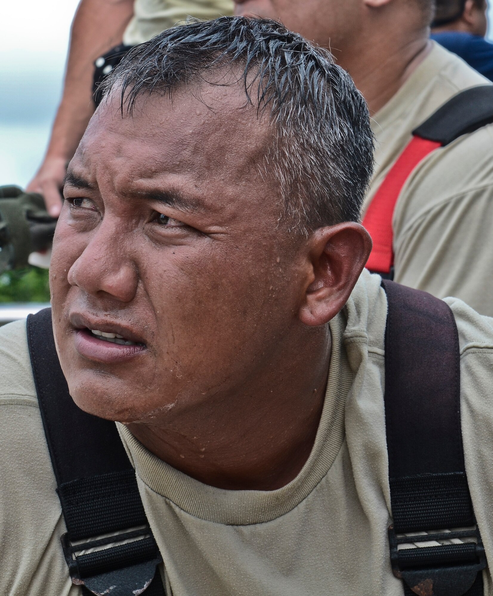 Tech. Sgt. Richard Benavente, 36th Civil Engineer Squadron Fire and Emergency Services NCO in charge of training, listens to his team’s post training review at the Saipan International Airport Sept. 20, 2013. This is the first time Airmen flew from Andersen Air Force Base, Guam, to Saipan to train with their counterparts while also meeting their annual training qualifications.
 (U.S. Air Force photo by Airman 1st Class Adarius Petty/Released)

