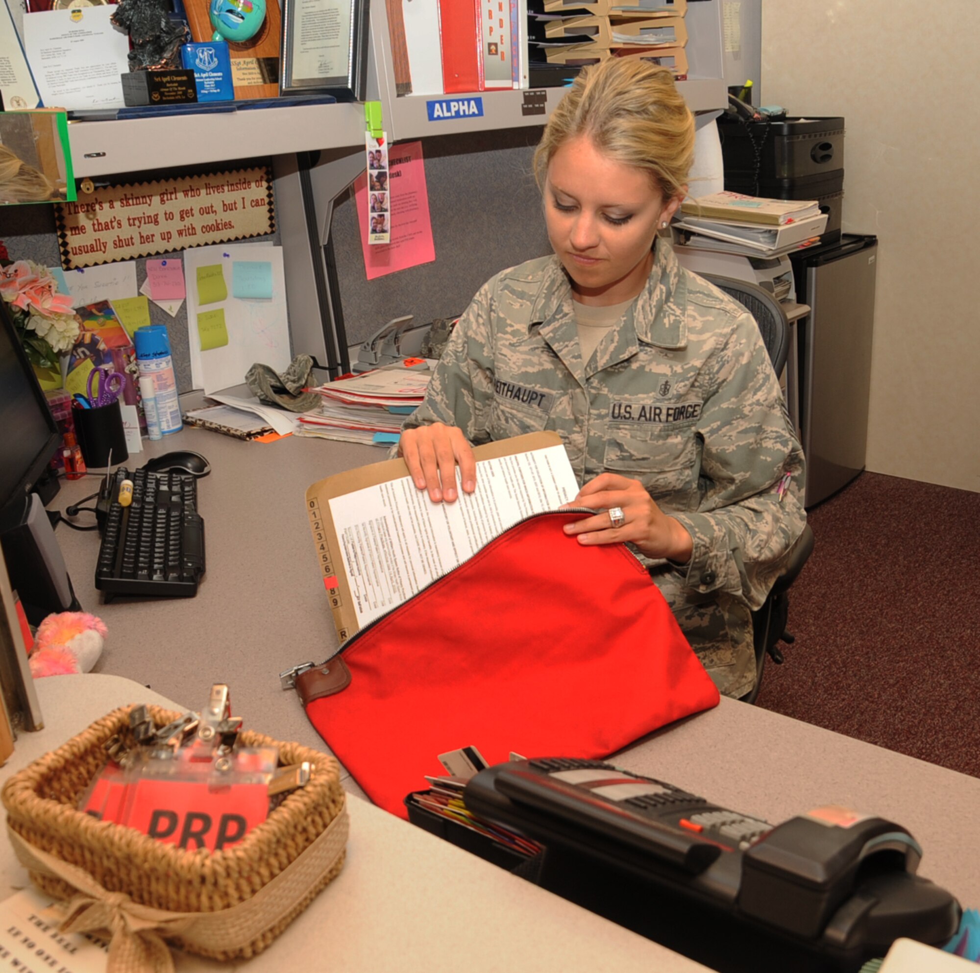 Staff Sgt. April Breithaupt, 2nd Aerospace Medicine Squadron Personnel Reliability Program administrative technician, secures a PRP medical record on Barksdale Air Force Base, La., Sept. 24, 2013. The PRP office works closely with other units within the medical field to ensure the PRP process goes smoothly and the PRP member gets qualified in the quickest possible time. (U.S. Air Force photo/Senior Airman Sean Martin)
