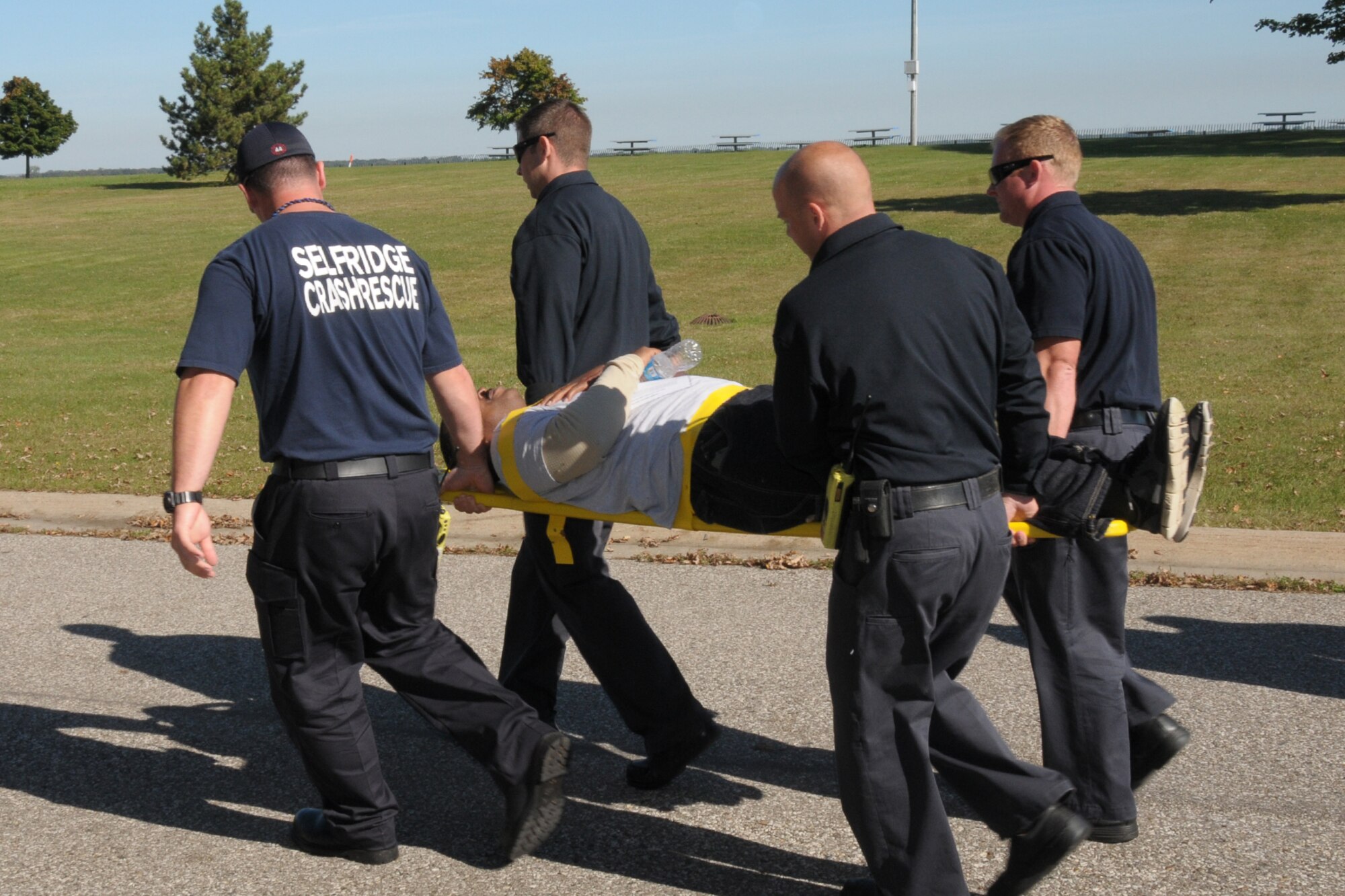 130924-z-YW189-088 Members of the 127th Civil Engineer Squadron
 Fire Department carry an “injured” victim for medical attention. The exercise scenario included a simulated bomb attack on the scene of the major accident response exercise at Selfridge Air National Guard Base, Mich., September 24, 2013 . The MARE exercises ensure first responders meet the Training Command’s mission. (U.S. Air National Guard photo by Staff Sgt. Samara Taylor/Released)
