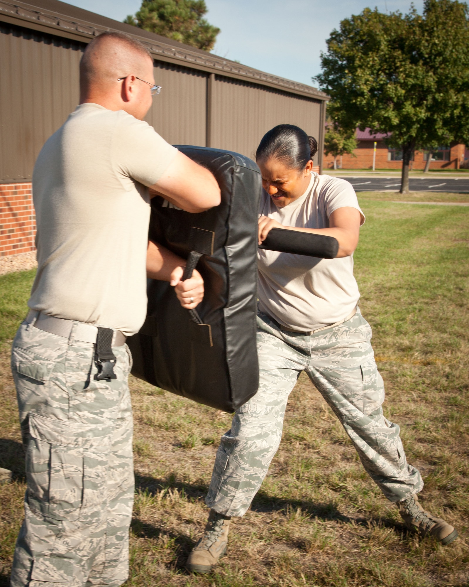 Senior Airman Inez Estrada, 934th Security Forces Squadron, trains against Staff Sgt. Kyle Umentum, 934 SFS, after being exposed to pepper spray during an exercise at the Minneapolis-St. Paul Air Reserve Station, Minn.  (U.S. Air Force photo/Shannon McKay)