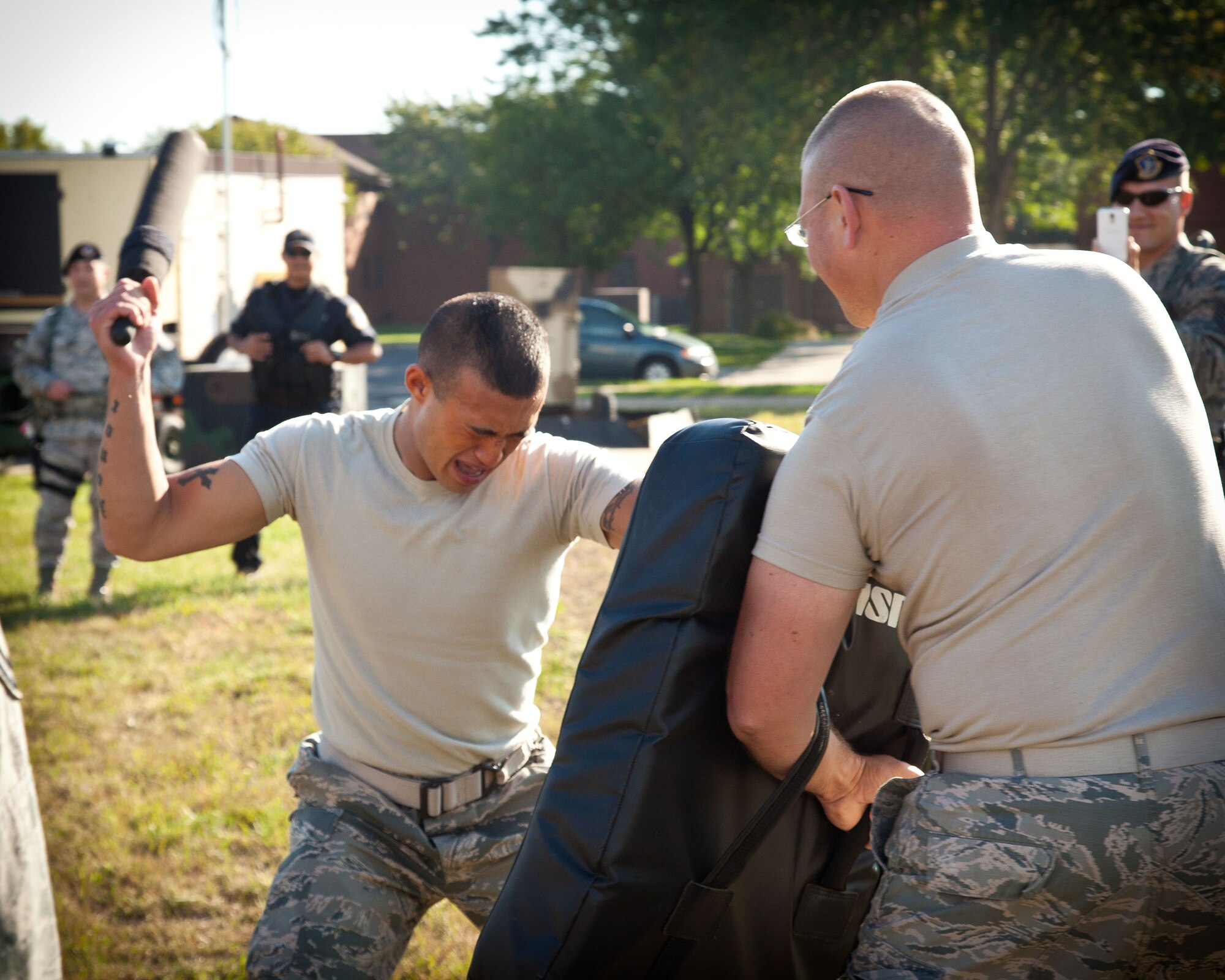 Senior Airman Joshua Cunningham, 934th Security Forces Squadron, trains against Staff Sgt. Kyle Umentum, 934 SFS, after being exposed to pepper spray during an exercise at the Minneapolis-St. Paul Air Reserve Station, Minn.  (U.S. Air Force photo/Shannon McKay)