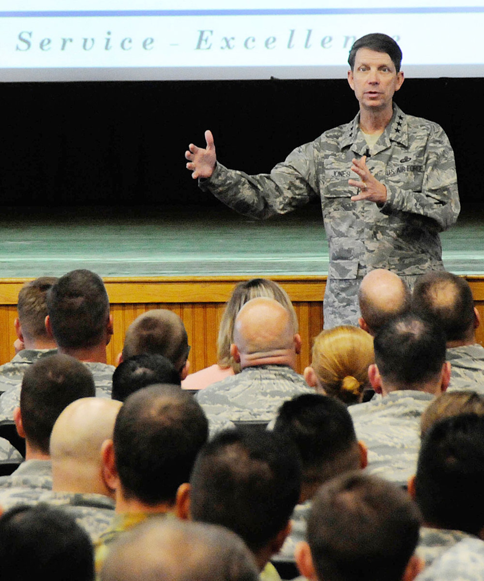 HANSCOM AIR FORCE BASE, Mass. – Lt. Gen. Darrell D. Jones, deputy chief of staff for Manpower, Personnel and Services, speaks to Airmen about the fiscal challenges facing the Air Force at one of his two all-call sessions at the base theater Sept. 20. In addition to discussing the budget uncertainty, Jones addressed topics such as sexual assault, physical fitness, and same-sex benefits. (U.S. Air Force photo by Linda LaBonte Britt)  