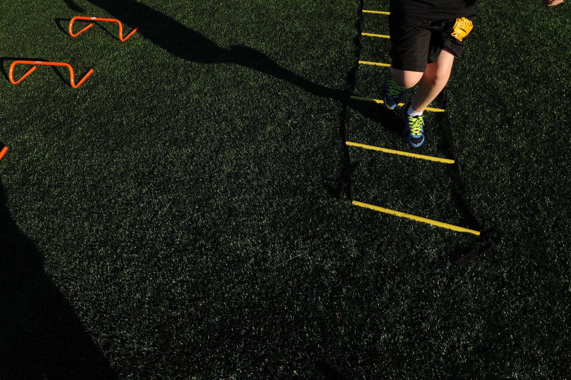 A child completes the agility ladder during the Salute to Play 60 Military Challenge at Joint Base Andrews, Md., Sept. 24, 2013. The initiative is part of the National Football League’s larger Play 60 campaign, which is designed to encourage kids to be active for 60 minutes a day to help reverse the trend of childhood obesity. (U.S. Air Force photo/ Airman 1st Class Nesha Humes)