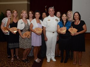 Navy Capt. Timothy Sparks, Joint Base Charleston deputy commander, thanks JB Charleston – Weapons Station’s tenant command Ombudsmen for their dedication and support during an Ombudsman Appreciation Luncheon Sept. 20, 2013 at the Redbank Club at JB Charleston – Weapons Station. (Left to right) Brandy Untch, Naval Nuclear Power Training Command, Sharon Schmelling, Naval Consolidated Brig Charleston, Eileen Marcus, Naval Nuclear Power Training Unit, Kimberly Walker, NNPTC, Michelle Taylor, NCBC, Ruth Warren-Goldston, Naval Health Clinic Charleston, Aimee Pereira, Navy Reserve European Command, Suerjee Lee, NHCC, Brooke Johnson, NOSC and Josie Quay, Naval Support Activity. Navy Ombudsmen assist and serve as liaisons between Sailors’ commands and families, enabling servicemembers to focus on their jobs. Ombudsmen disseminate information, assist with crisis management and provide social and recreational opportunities for families. They are “network specialists” and often find themselves taking on the role of mother, mentor, friend and confidante. (U.S. Navy photo/ Petty Officer 2nd Class Chad Hallford)


