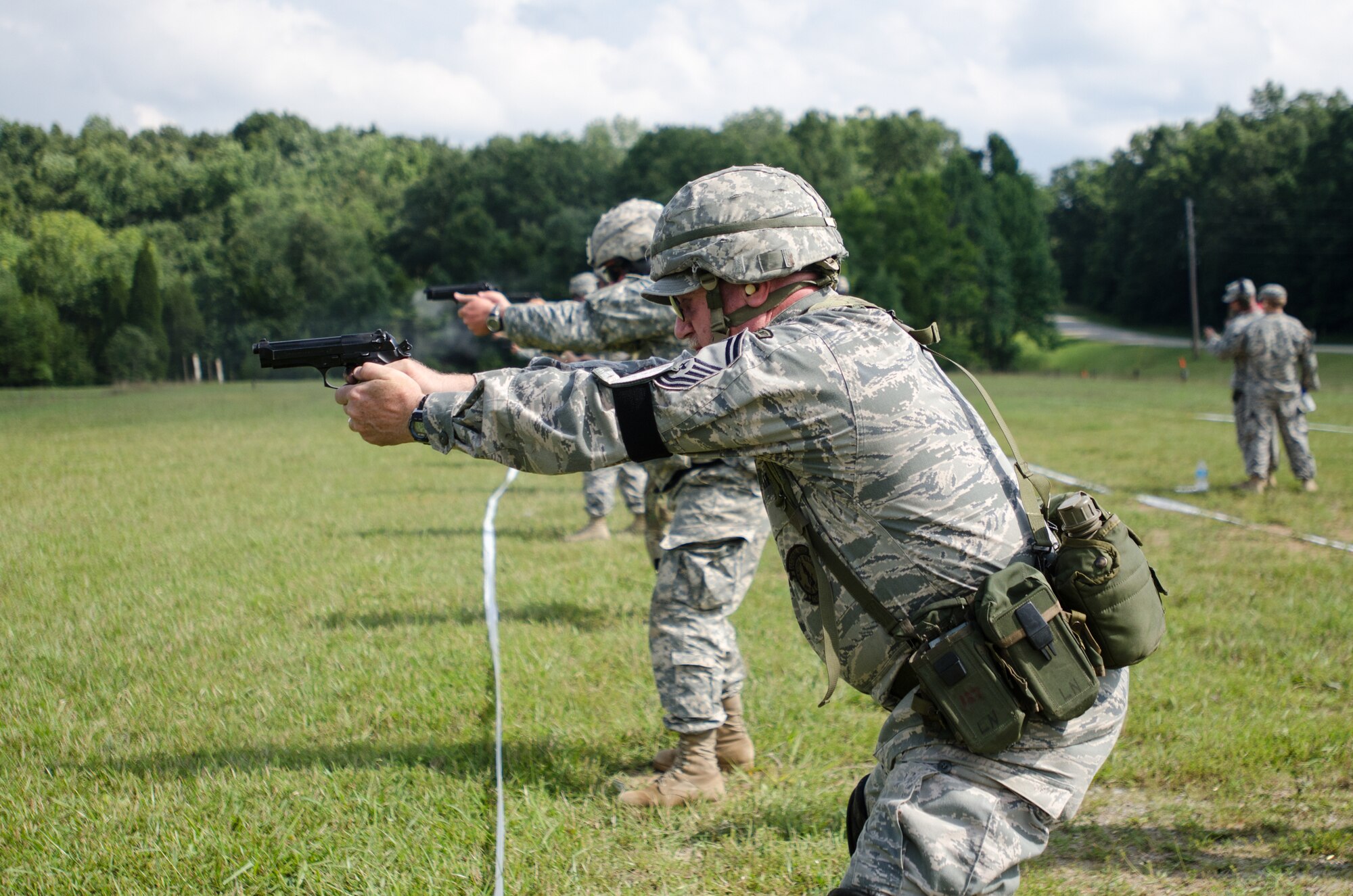 Senior Master Sgt. Darryl Loafman, pistol team captain for the 123rd Airlift Wing marksmanship team, fires an M9 pistol during the Adjutant General’s Kentucky National Guard State Rifle and Pistol Training Event on July 27, 2013, at Fort Knox, Ky. Fifteen Airmen from the 123rd Airlift Wing competed in the contest July 27 and 28. The 123rd took first place in the pistol team competition, rifle team competition and overall aggregate. (U.S. Air National Guard photo by Master Sgt. Phil Speck)