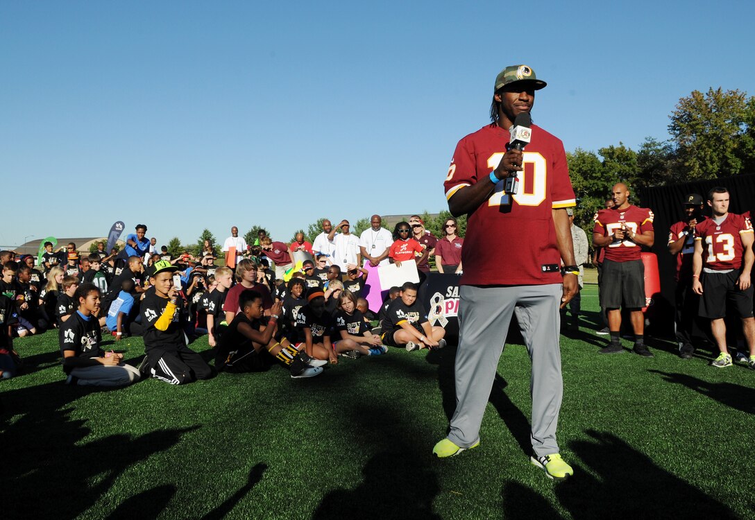 Washington Redskins quarterback Robert Griffin III speaks to the children about his personal connection with the military during the Salute to Play 60 Military Challenge at Joint Base Andrews, Md., Sept. 24, 2013. The son of Army parents, Griffin is familiar with the military lifestyle. (U.S. Air Force photo/ Airman 1st Class Nesha Humes)
