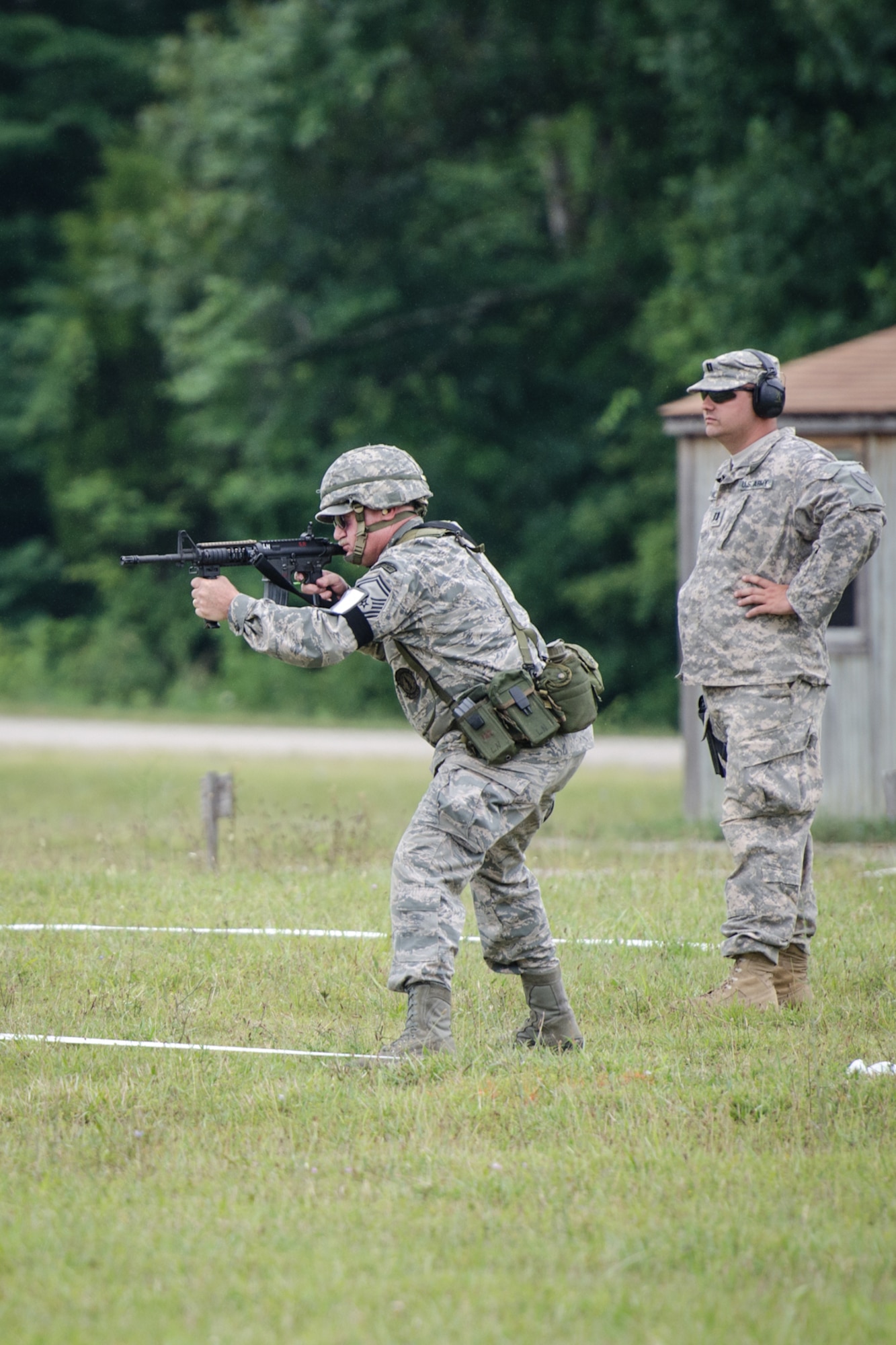Senior Master Sgt. Darryl Loafman, pistol team captain for the 123rd Airlift Wing marksmanship team, fires an M4 rifle during the Adjutant General’s Kentucky National Guard State Rifle and Pistol Training Event on July 27, 2013, at Fort Knox, Ky. Fifteen Airmen from the 123rd Airlift Wing competed in the contest July 27 and 28. The 123rd took first place in the pistol team competition, rifle team competition and overall aggregate. (U.S. Air National Guard photo by Master Sgt. Phil Speck)