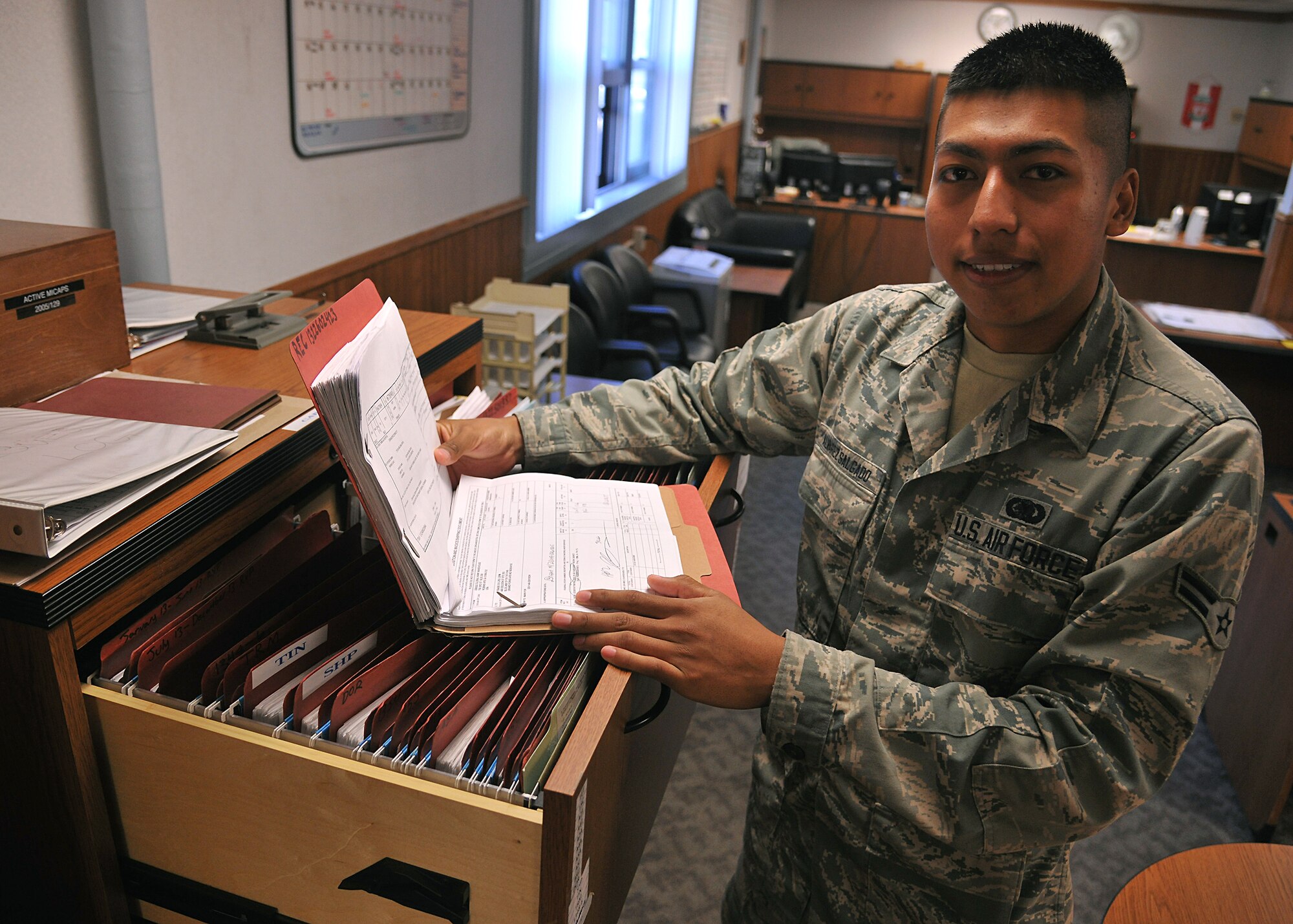 Airman 1st Class Marcelo Alvarez Salgado, 319th Logistics Readiness Squadron customer support apprentice, searches through a file  Sept. 25, 2013, on Grand Forks Air Force Base, N.D. Alvarez was selected to be the 319th Air Base Wing Warrior of the Week for the fourth week of September 2013. (U.S. Air Force photo/ Senior Airman Xavier Navarro)
