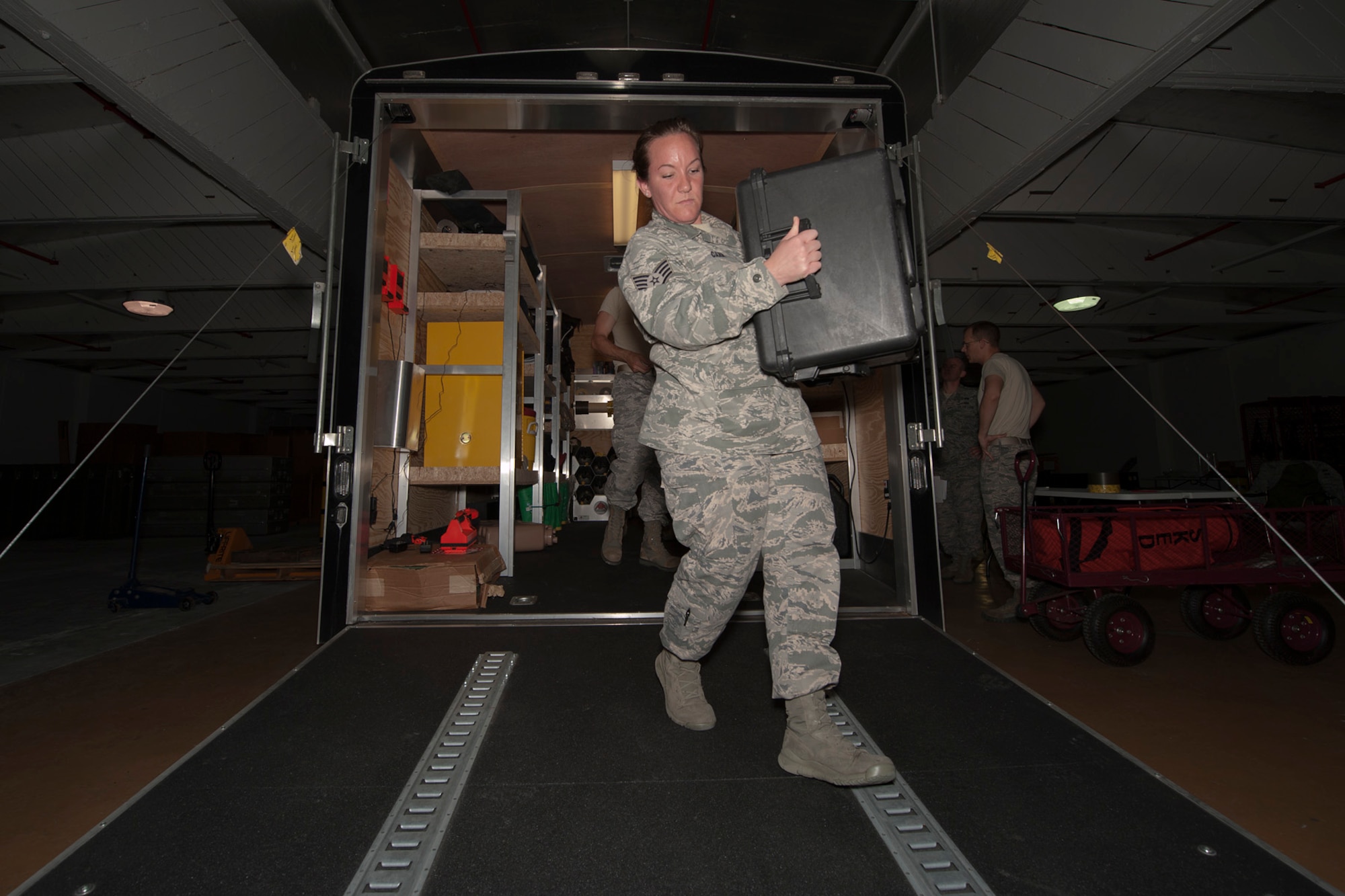 U.S. Air Force Staff Sgt. Sarah Carr, 65th Medical Operations Squadron bioenvironmental engineering craftsman, prepares personal protection equipment for use during a joint biological response training exercise Sept. 20, 2013, at Lajes Field, Azores. The exercise is to test the effectiveness of emergency managers and bioenvironmental engineers working together in a crisis situation, maintain proficiency in duties, and identify strength or improvement capabilities. Carr, a Robinson, Ill., native, is the Occupational Health non-commissioned officer in charge. (U.S. Air Force photo by Tech. Sgt. Paul Villanueva II/Released)
