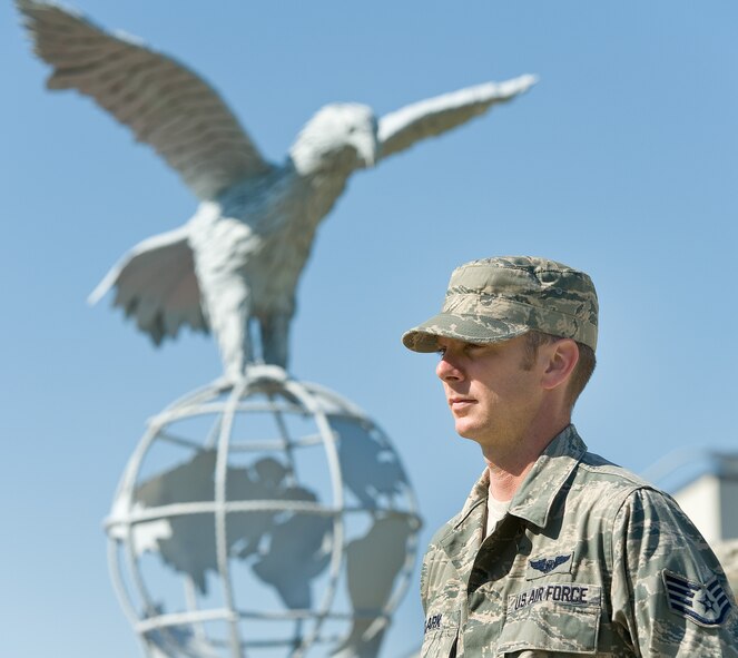 Staff Sgt. Matthew Clark, a loadmaster with the 3rd Airlift Squadron, stands at parade rest during the prisoner of war/missing in action vigil Sept, 20, 2013, at Dover Air Force Base, Del. Team Dover members stood vigil at the base flag pole for a total of 24 hours in shifts of 15 minutes honoring those listed as POW or MIA. (U.S. Air Force photo/Roland Balik)