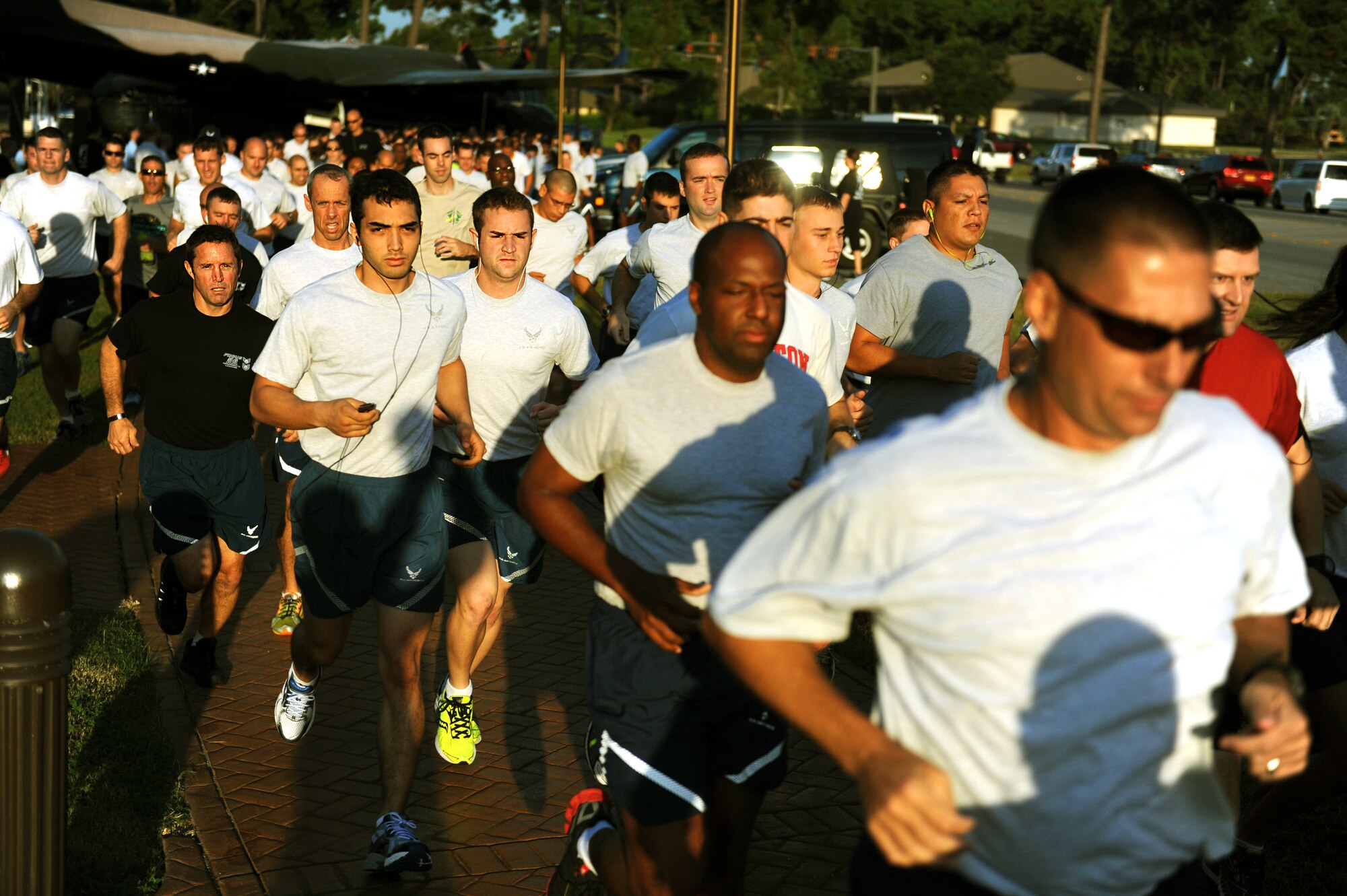 More than 400 Air Commandos take off to begin a 3-mile commemorative run at the conclusion of a Prisoner of War/Missing in Action Recognition Day ceremony at the air park on Hurlburt Field, Fla. Sept. 20, 2013. A single runner was given a baton containing a list of POW/MIA names to be passed from Airman-to-Airman during the run until it made to the first place runner. (U.S. Air Force photo/Senior Airman Kentavist P. Brackin)