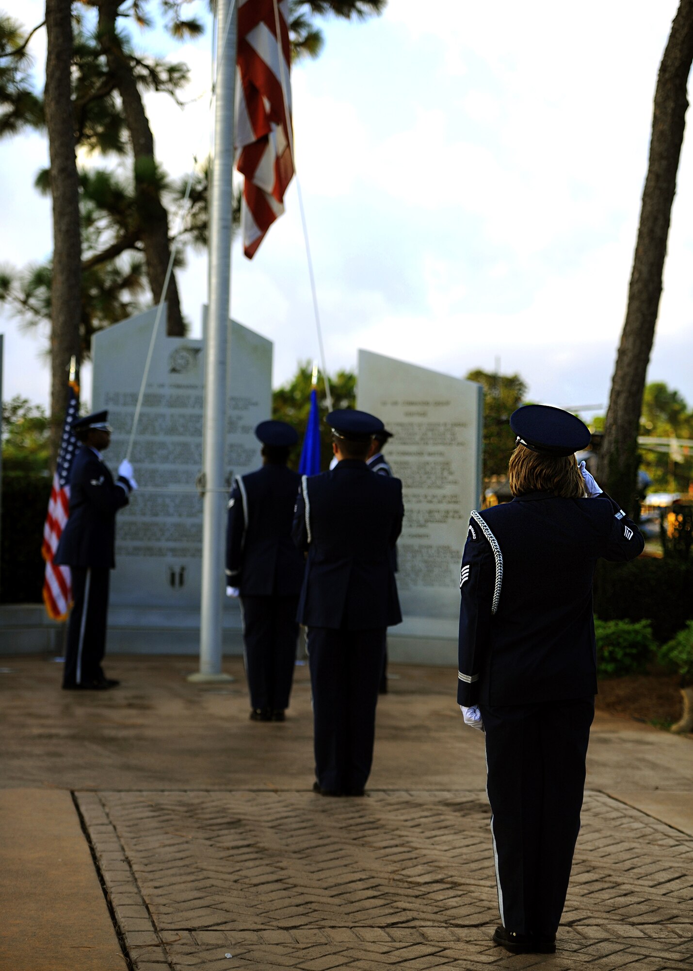 Hurlburt Field Honor Guard members prepare to raise the Prisoner of War/Missing in Action flag during a ceremony at the air park on Hurlburt Field, Fla., Sept. 20, 2013. Following the ceremony, more than 400 Air Commandos participated in a three-mile run. (U.S. Air Force photo/Senior Airman Kentavist P. Brackin)