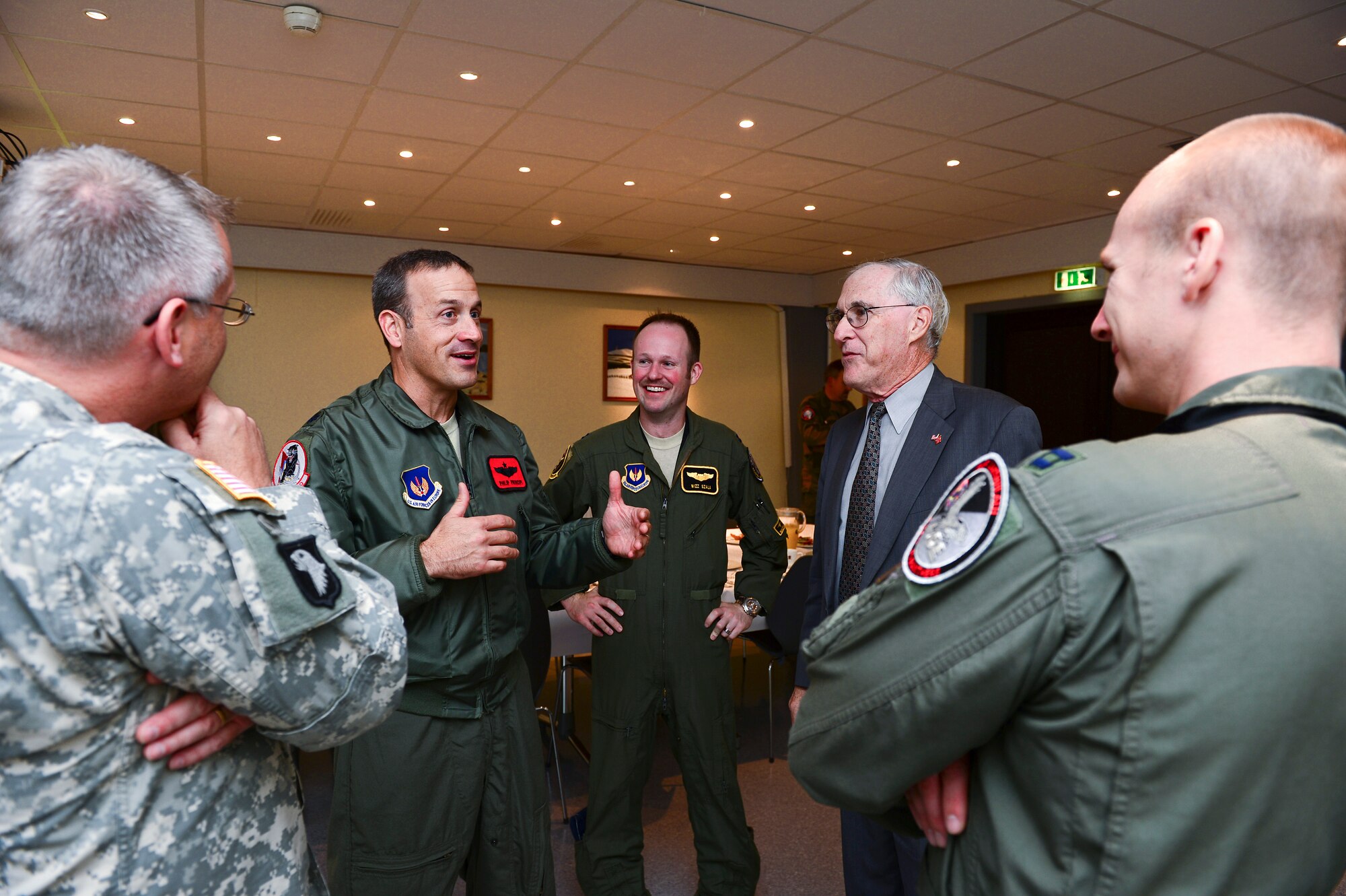Barry White, U.S. Ambassador to Norway, views the cockpit of an F-15C Eagle during his visit to Bodø Main Air Station, Norway, Sept. 20, 2013. White met with leaders and personnel from the United States, Norway, Finland and Sweden on station in support of Arctic Challenge Exercise 2013. ACE-13 is a combined exercise, with NATO allies and regional partners that provides an opportunity for all forces to integrate operations and build upon our international relationships. Approximately 30 aircraft and 600 personnel deployed from RAFs Lakenheath and Mildenhall in support of ACE-13. (U.S. Air Force photo by Master Sgt. Lee Osberry/Released)