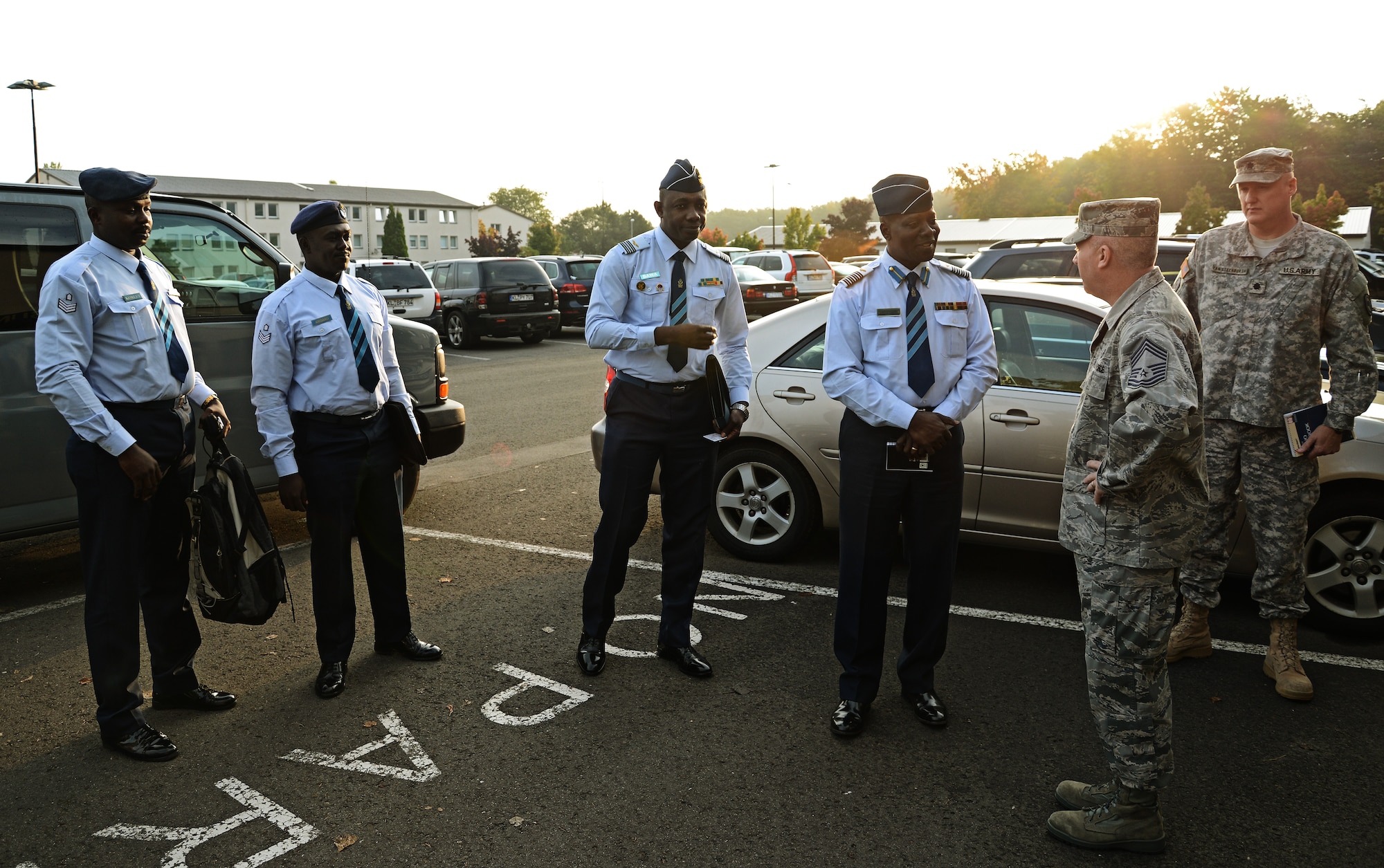 Chief Master Sgt. Chris Moore, Kisling NCO Academy commandant, greets Col. Appiah-Agyekum of the Ghana air force as he and his team arrive at the Academy on Kapaun Air Station, Germany Sept. 25, 2013. Leaders of Ghana's air force visited the NCO academy to better understand how the U.S. Air Force develops its enlisted force. They plan on taking the information back to develop their own professional military education program in Ghana. (U.S. Air Force photo/ Staff Sgt. Ryan Crane)
