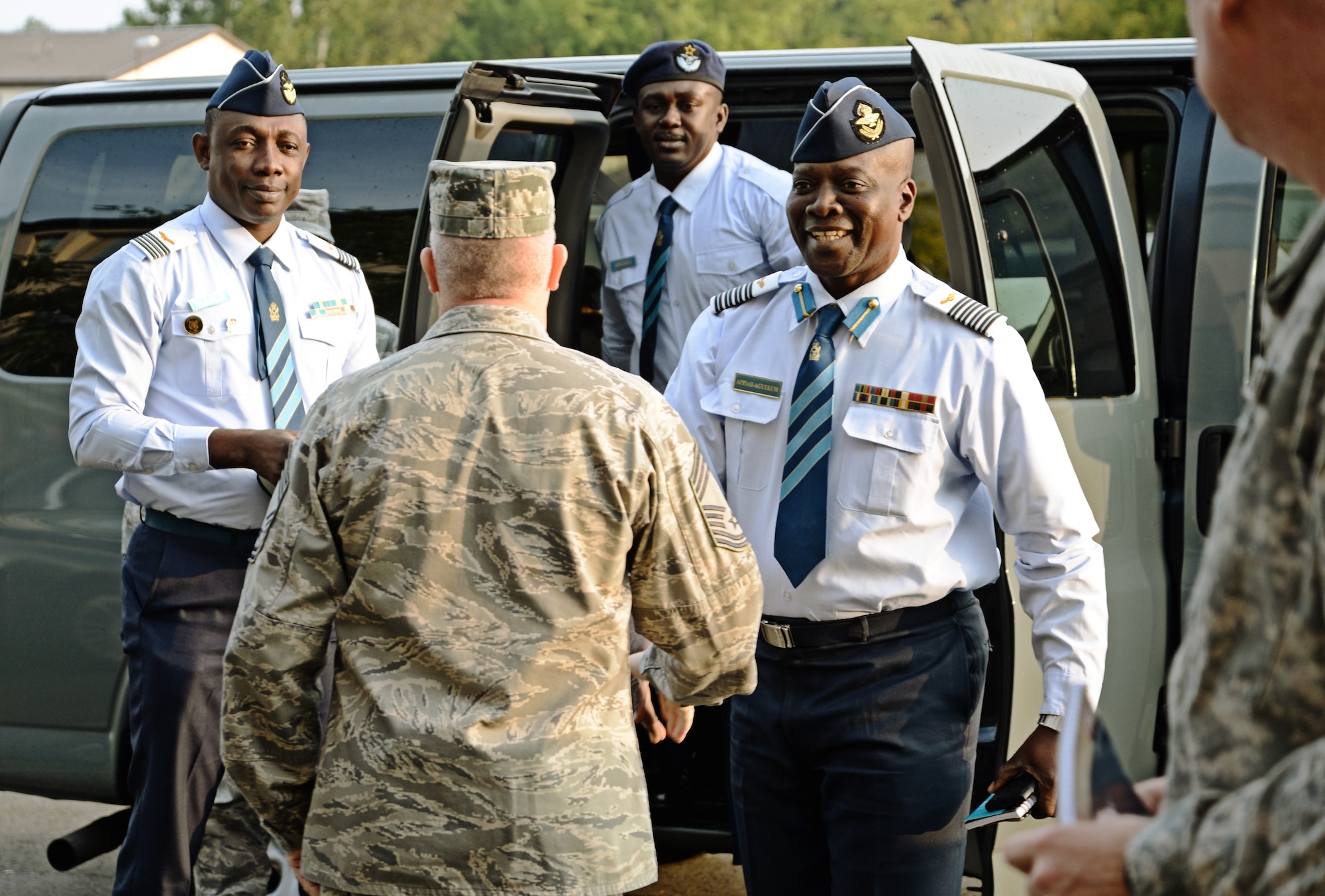 Chief Master Sgt. Chris Moore, Kisling NCO Academy commandant, greets Col. Appiah-Agyekum of the Ghana air force as he and his team arrive at the Academy on Kapaun Air Station, Germany Sept. 25, 2013. Leaders of Ghana's air force visited the NCO academy to better understand how the U.S. Air Force develops its enlisted force. They plan on taking the information back to develop their own professional military education program in Ghana. (U.S. Air Force photo/ Staff Sgt. Ryan Crane)