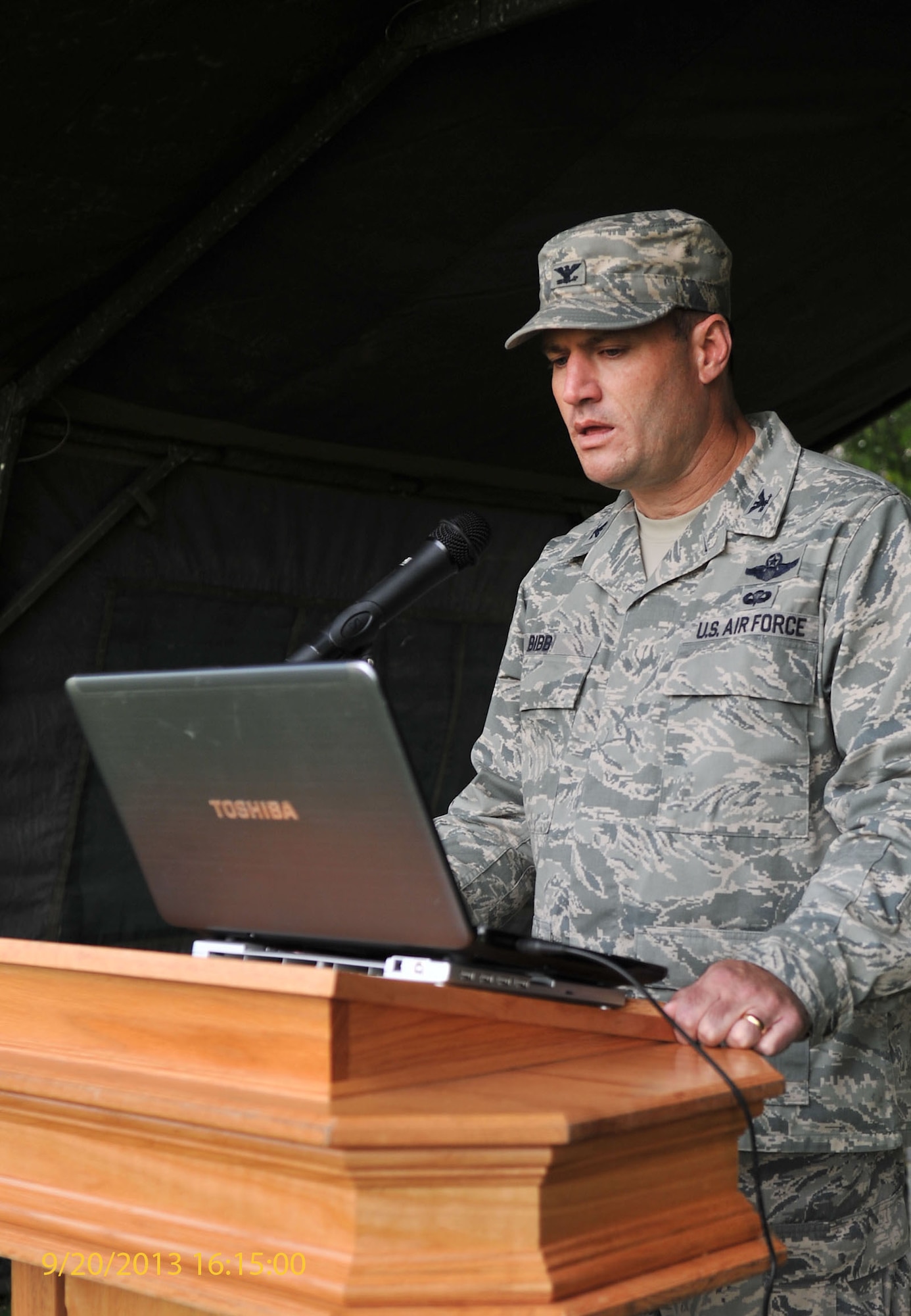 U.S. Air Force Col. Kenneth T. Bibb Jr., 100th Air Refueling Wing commander, reads names of POW/MIAs during a vigil Sept. 20, 2013, on RAF Mildenhall, England. The vigil was held for 24 hours, with Team Mildenhall members reciting the names of POW/MIA service members the entire ceremony. Part of POW/MIA remembrance week, the vigil honored those who have not returned home. (U.S. Air Force photo by Airman 1st Class Kyla Gifford/Released)