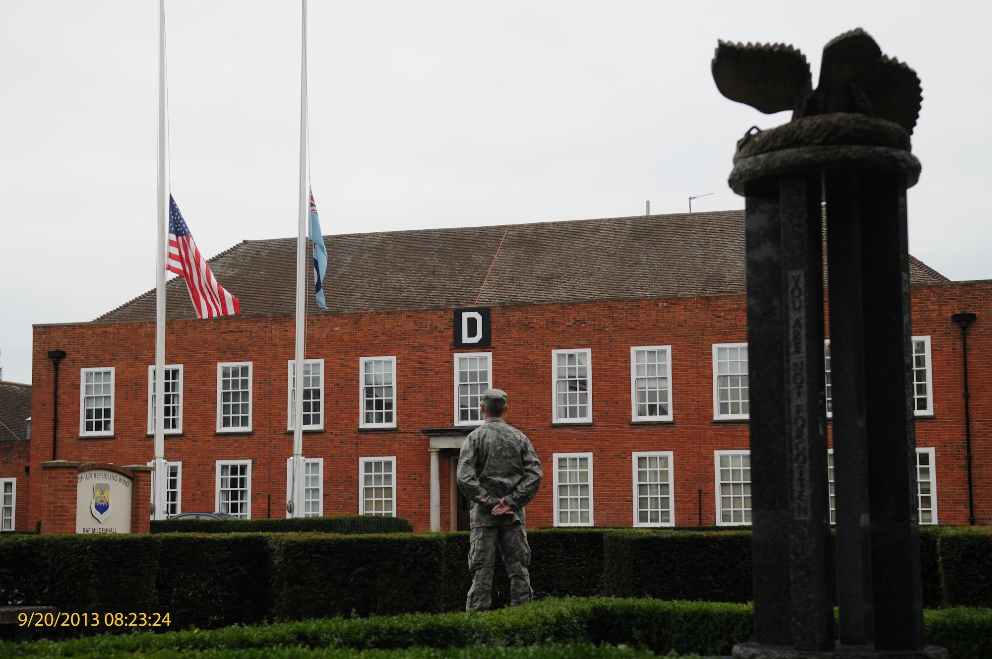 A Team Mildenhall member silently stands at parade rest to honor POW/MIA during a vigil Sept. 20, 2013, on RAF Mildenhall, England. Airmen continually rotated reading names and standing at parade rest to guard the POW/MIA monument for 24 hours to honor POW/MIA service members. Part of POW/MIA remembrance week, the vigil honored those who have not returned home. (U.S. Air Force photo by Airman 1st Class Jonathan Light/Released)