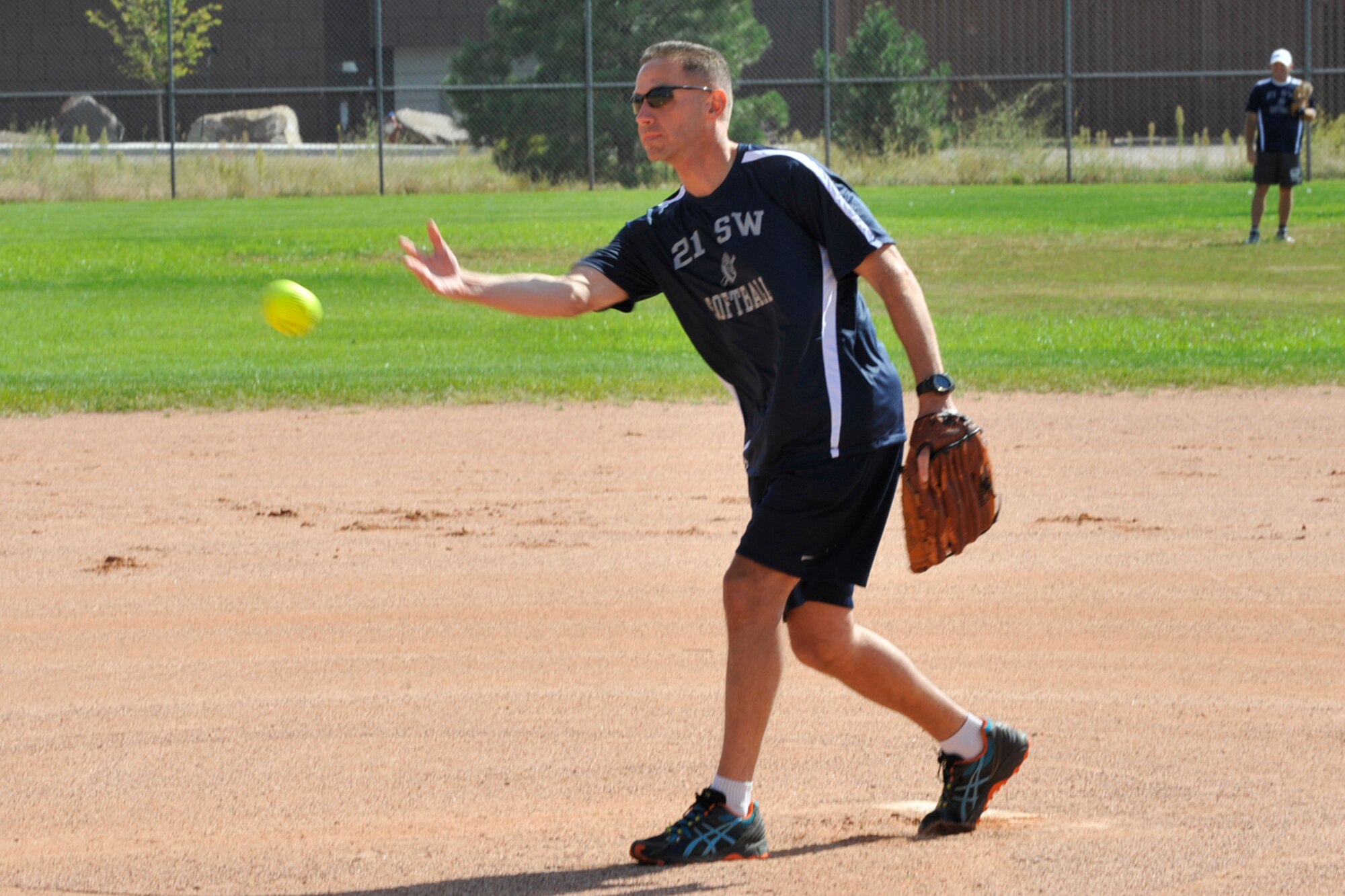 PETERSON AIR FORCE BASE, Colo. – Chief Master Sgt. Rich Redman, 21st Space Wing command chief, delivers another strike during the Space World Series Sept. 20. The 21st Space Wing Chiefs and Eagles softball team competed against the 50th Space Wing Chiefs and Eagles softball team. Redman earned a win as Team 2-1 defeated Team 5-0 by a score of 21-15. (U.S. Air Force photo/Robb Lingley)