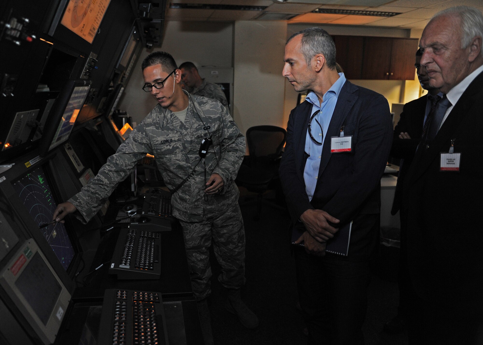 Senior Airman Joshua Lopez, 39th Operations Squadron air traffic controller, explains the advantages of the Standard Terminal Automation Replacement System upgrade to members of the NATO Parliamentary Assembly Sept. 24, 2013 at Incirlik Air Base, Turkey. The STARS upgrade replaced equipment designed in the 1950s and 1960s. (U.S. Air Force photo by Senior Airman Chase Hedrick/Released)