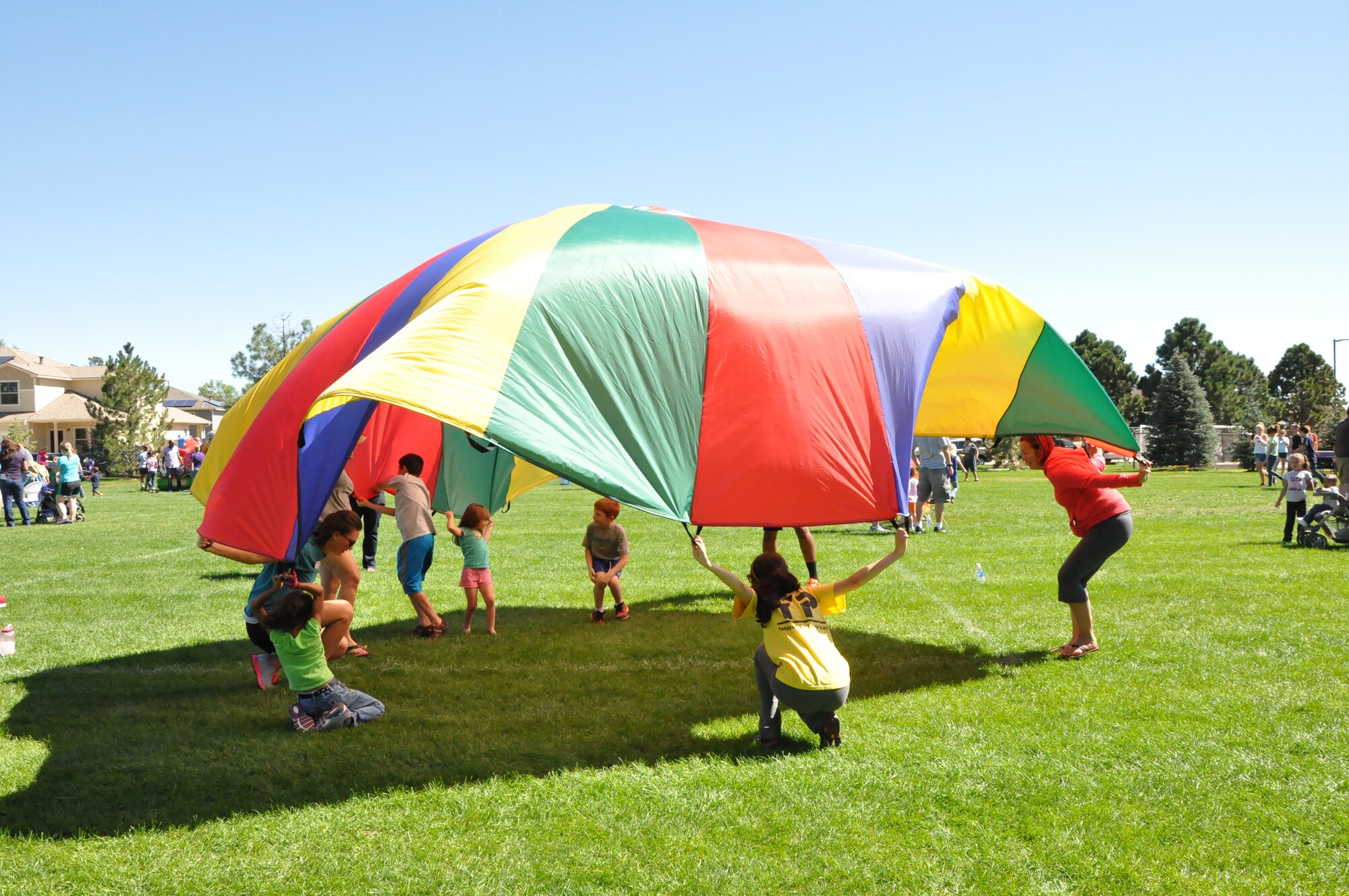 PETERSON AIR FORCE BASE, Colo. - Peterson Air Force Base families participate in the Worldwide Day of Play at Patriot Park Sept. 21. The event was hosted by the 21st Force Support Squadron and included a mechanical bull, bounce house and slide, tug of war, a football throw, climbing wall, car show and more. The goal of the Worldwide Day of Play is to encourage children to get outside and play. (U.S. Air Force photo/Tech. Sgt. Jared Marquis)