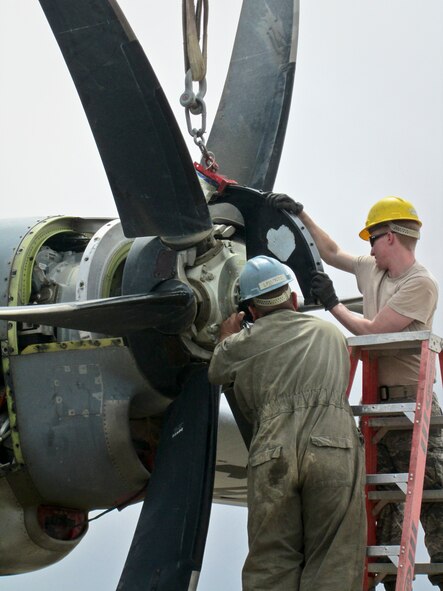Airmen forward deployed from the 379th Expeditionary Maintenance Squadron assist in a crash damage reclamation and demilitarization project of a C-130J Super Hercules at a forward operating base in Afghanistan, July 1, 2013. The team recovered 250 components totaling more than $20 million. (U.S. Air Force photo)