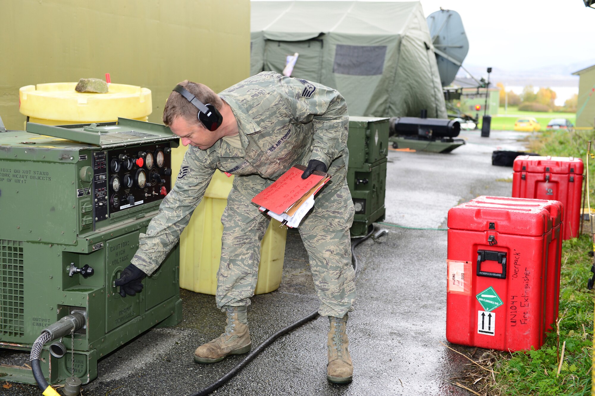 Staff Sgt. James Kanrar, 1st Combat Communication electrical power production craftsman, performs maintenance on a generator at Bodø Main Air Station, Norway, Sept. 22, 2013. Kanrar is amongst approximately 600 personnel deployed, from multiple bases within U.S. Air Forces in Europe-Air Forces Africa, in support of the Arctic Challenge exercise 2013 (ACE-13). ACE-13 is a combined exercise with NATO allies and regional partners, which promotes continued interoperability between the United States, Norway, Sweden and Finland. (U.S. Air Force photo by Master Sgt. Lee Osberry/Released)