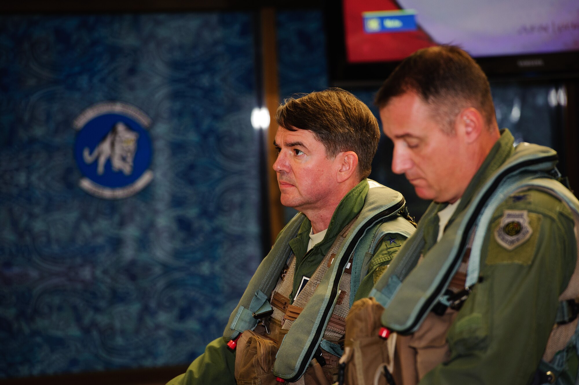 Lt. Gen. Jan-Marc Jouas, Republic of Korea and U. S. Combined Forces Command, Air Component Command commander, left, and Col. Peter Bilodeau, 8th Operations Group commander, are briefed by members of the Wolf Pack scheduling and weather offices at Kunsan Air Base, Republic of Korea, Sept. 23, 2013. Jouas visited Kunsan to view how the Wolf Pack completes its mission first hand. (U.S. Air Force photo by Senior Airman Armando A. Schwier-Morales/ Released)