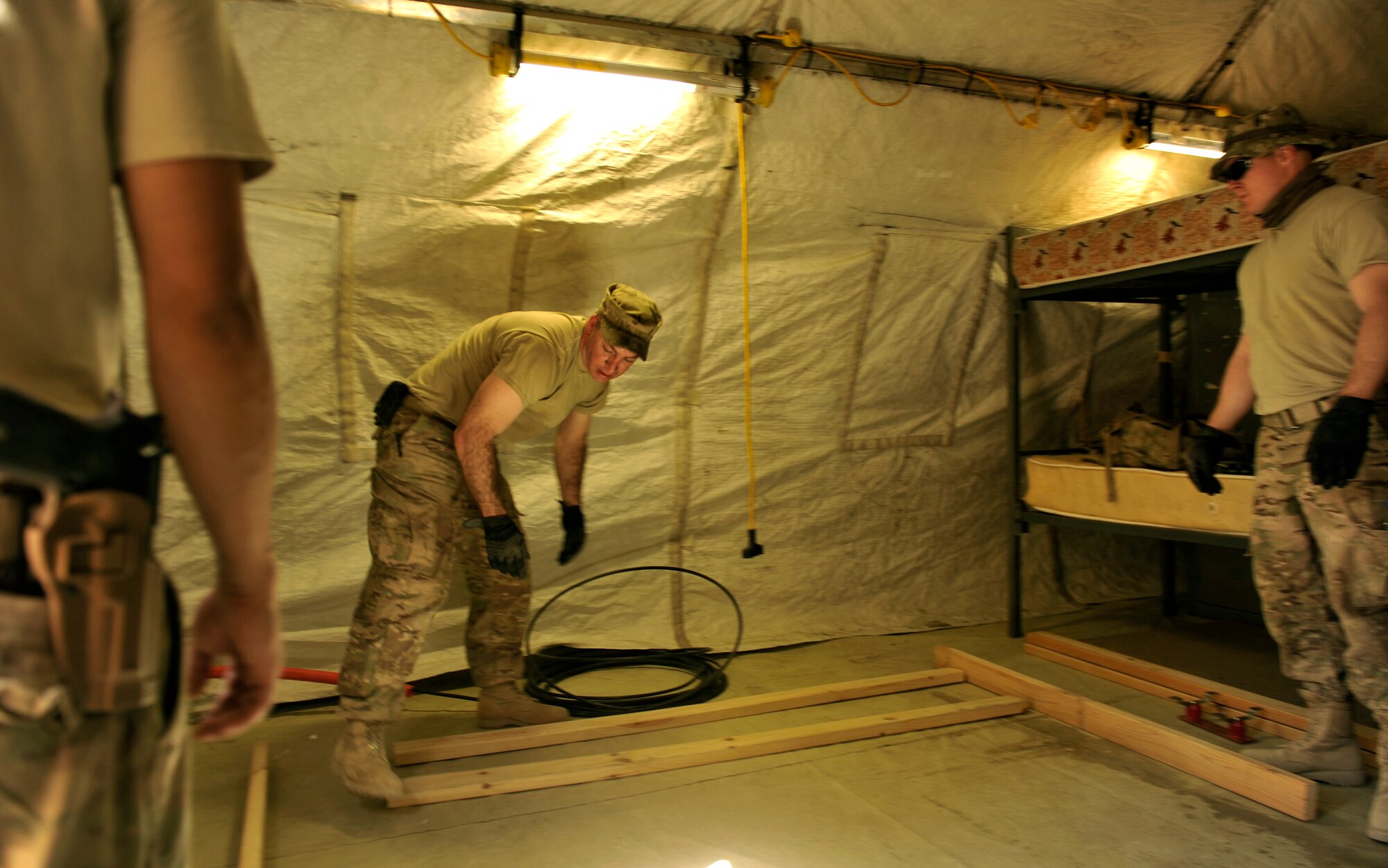 Master Sgt. Douglas Threatt, 455th Expeditionary Communications Squadron, frames out a computer tower for a future communication equipment room on Bagram Airfield, Afghanistan. The room will contain networking equipment providing connectivity for the Jordanian forces. Threatt is deployed from Ramstein Air Base, Germany. (U.S. Air Force photo/ Staff Sgt. Stephenie Wade)