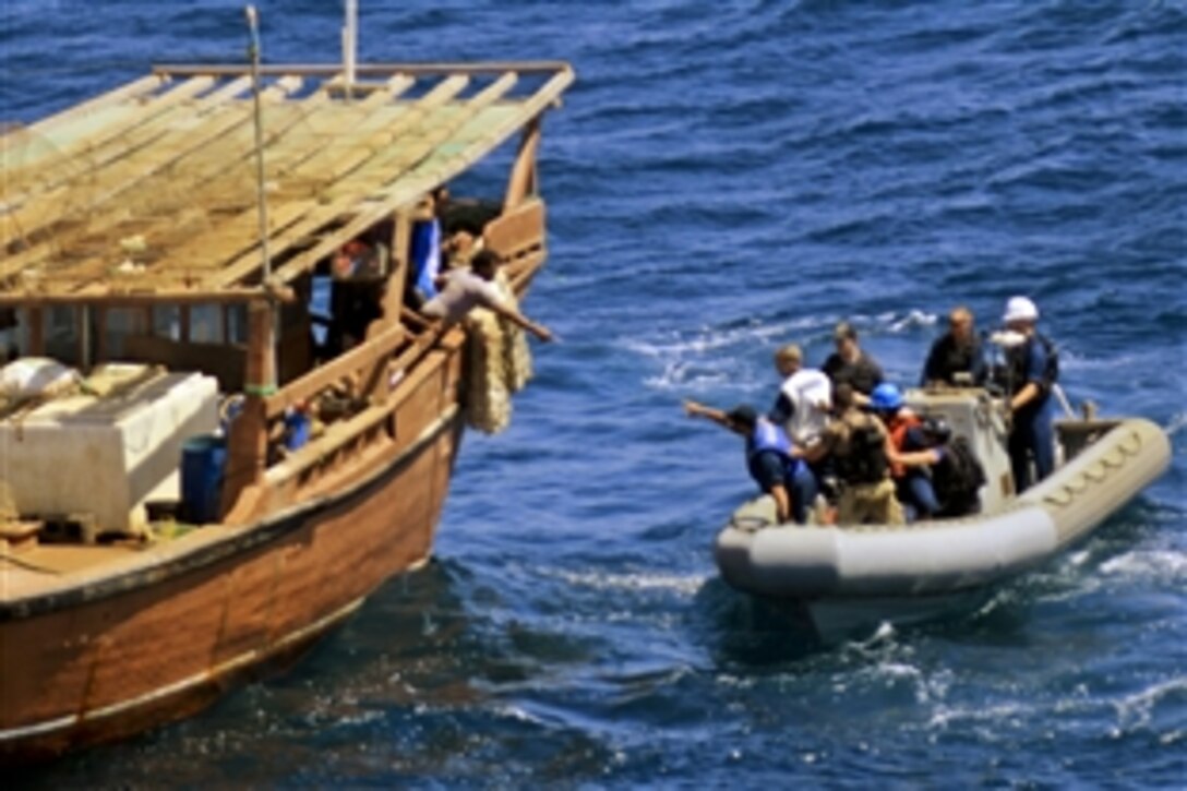 U.S. Navy sailors prepare to provide humanitarian assistance to a stranded fishing dhow in the Arabian Gulf, Sept. 24, 2013. The sailors are assigned to the guided-missile cruiser USS Gettysburg, which is supporting maritime security operations and theater security cooperation efforts in the U.S. 5th Fleet area of responsibility.