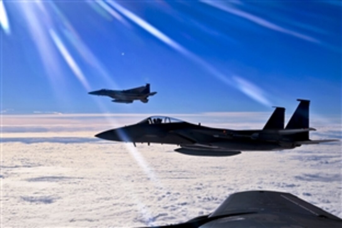 Two F-15C Eagles prepare to return to their simulated air combat portion of the Arctic Challenge exercise over Norway, Sept. 20, 2013. The pilots are assigned to the 48th Fighter Wing. Six nations participated in the exercise to boost interoperability between NATO, the United States, the United Kingdom and members of the Nordic Defense Cooperation.