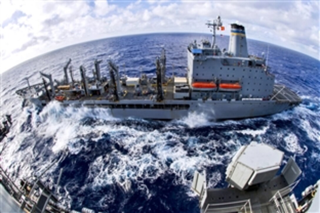 The fleet replenishment oiler USNS Yukon steams next to the aircraft carrier USS George Washington during a replenishment in the Pacific Ocean, Sept. 18, 2013. The George Washington was supporting maritime security operations and theater security cooperation efforts in the U.S. 7th Fleet area of responsibility.