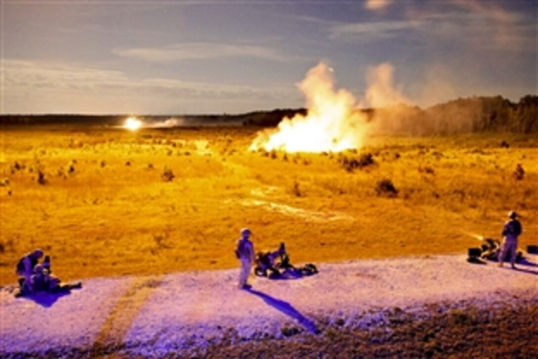Marines fire Mk. 19 grenade launchers as part of a grenade training exercise at night on Camp Lejeune, N.C., Sept. 17, 2013. The Marines, assigned to Bridge Company, 8th Engineer Support Battalion, 2nd Marine Logistics Group, waited for illumination flares to light the range before firing on targets.