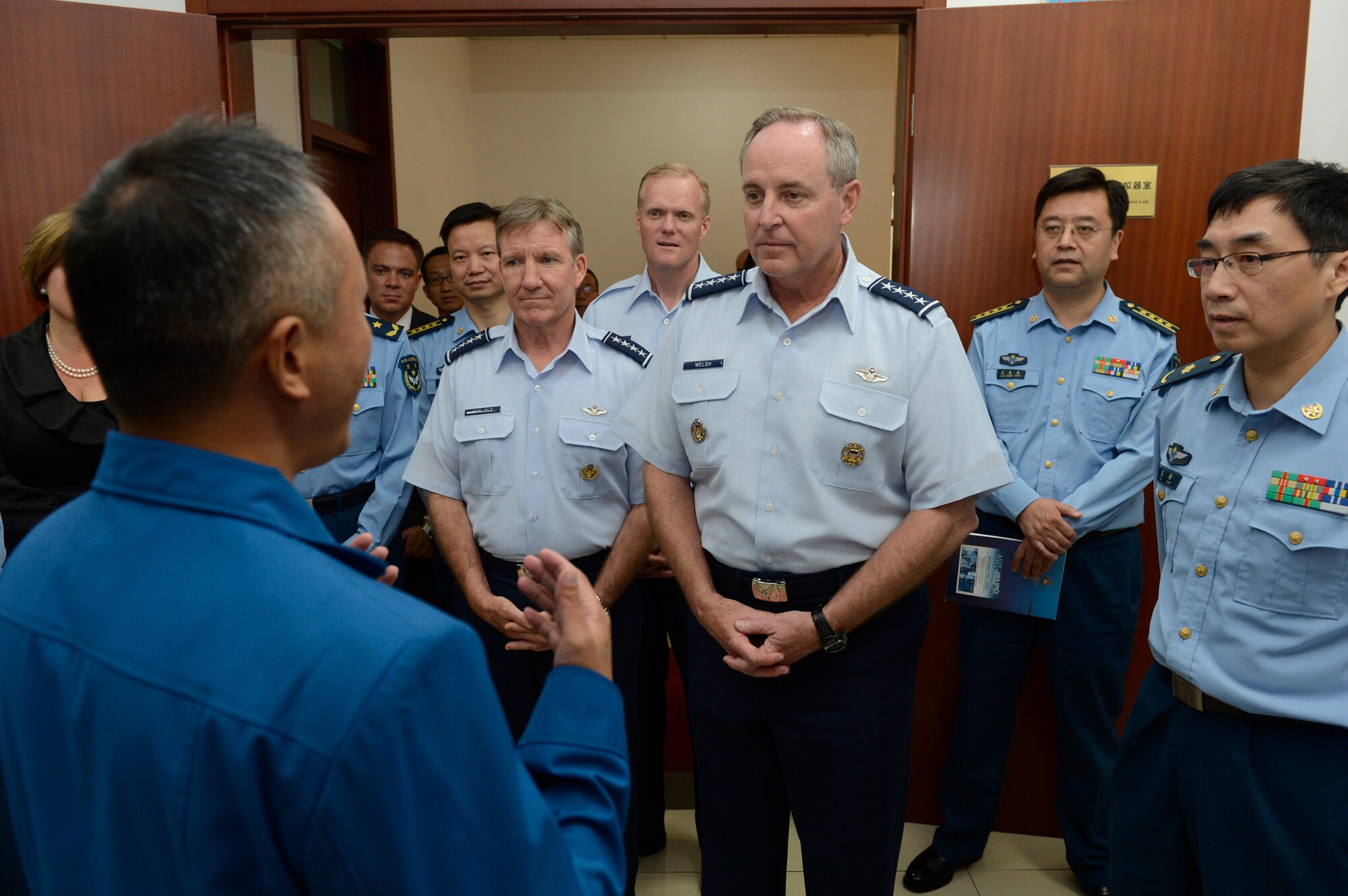 Air Force Chief of Staff Gen. Mark A. Welsh III, Gen. Herbert "Hawk" Carlisle, Pacific Air Forces commander, and Chief Master Sgt. of the Air Force James A. Cody, receive a tour of of the Chinese Air Force Aviation Medicine Research Institute, in Beijing, China, Sept. 25, 2013.  Welsh, Carlisle and Cody will visit with various military leaders as part of a weeklong visit. 