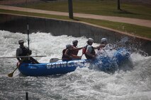 Marines from Headquarters and Headquarters Squadron face the rushing rapids during an Operation Adrenaline Rush trip to the National Whitewater Center in Charlotte, N.C., Sept. 13.