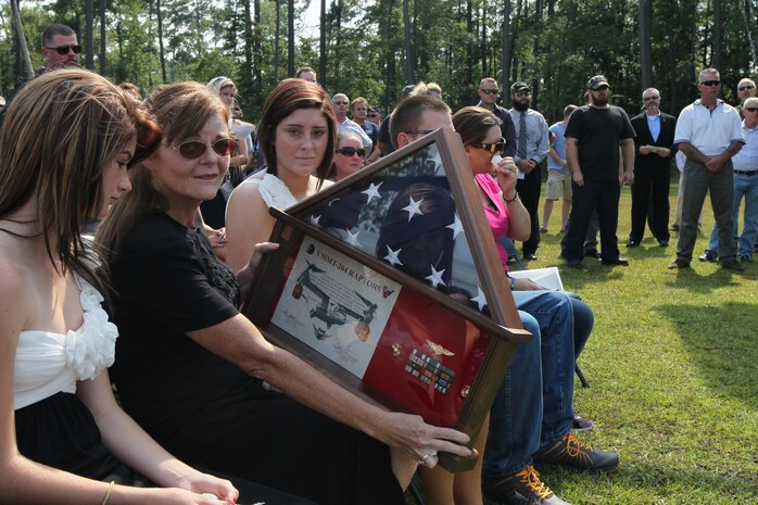 Family and friends gathered to honor the memory of retired Master Gunnery Sgt. Jerry G. Grier at a memorial service held at the aviation memorial aboard Marine Corps Air Station New River, Sept. 13. Grier served more than 26 years as a Marine and continued to serve his nation as a civilian contractor.