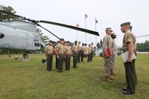 Pfc. Michael H. Powers and Pfc. Jaleel R. Williams graduate from the Center for Naval Aviation Technical Training as the last two CH-46E Sea Knight flight line mechanics in a ceremony by the front gate aviation memorial aboard Marine Corps Air Station New River, Sept. 13. The two Marine reservists will join Marine Medium Helicopter Squadron 774, located in Naval Station Norfolk, Va.