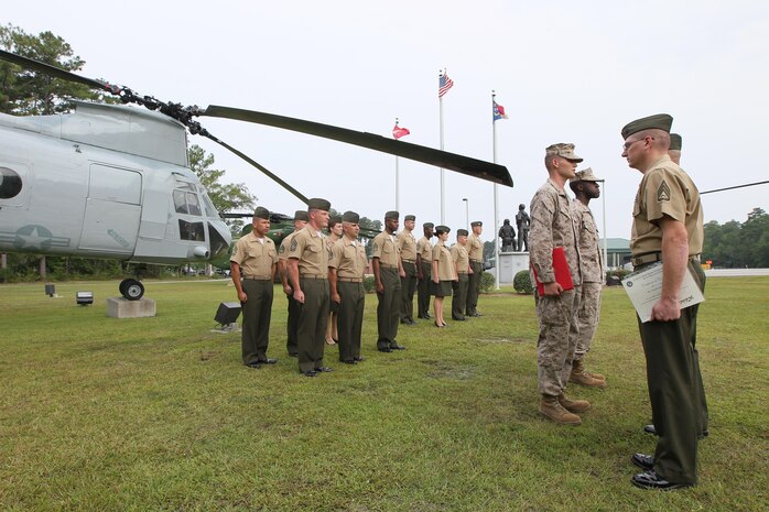 Pfc. Michael H. Powers and Pfc. Jaleel R. Williams graduate from the Center for Naval Aviation Technical Training as the last two CH-46E Sea Knight flight line mechanics in a ceremony by the front gate aviation memorial aboard Marine Corps Air Station New River, Sept. 13. The two Marine reservists will join Marine Medium Helicopter Squadron 774, located in Naval Station Norfolk, Va.