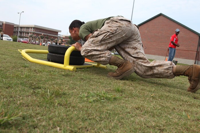 Marines compete in the High Intensity Tactical Training Ultimate Warrior Challenge at the HITT center aboard Marine Corps Air Station New River, Sept. 13. Weighted sled drags were a part of one of the challenges presented during the competition.