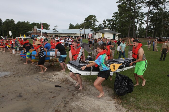 Headquarters and Headquarters Squadron Marines make a mad dash to the water's edge at the start of the H&HS regatta held at the marina aboard Marine Corps Air Station New River, Sept. 20.