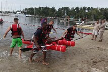 Aircraft Rescue and Firefighting Marines take first place in the Headquarters and Headquarters Squadron regatta held at the marina aboard Marine Corps Air Station New River, Sept. 20.