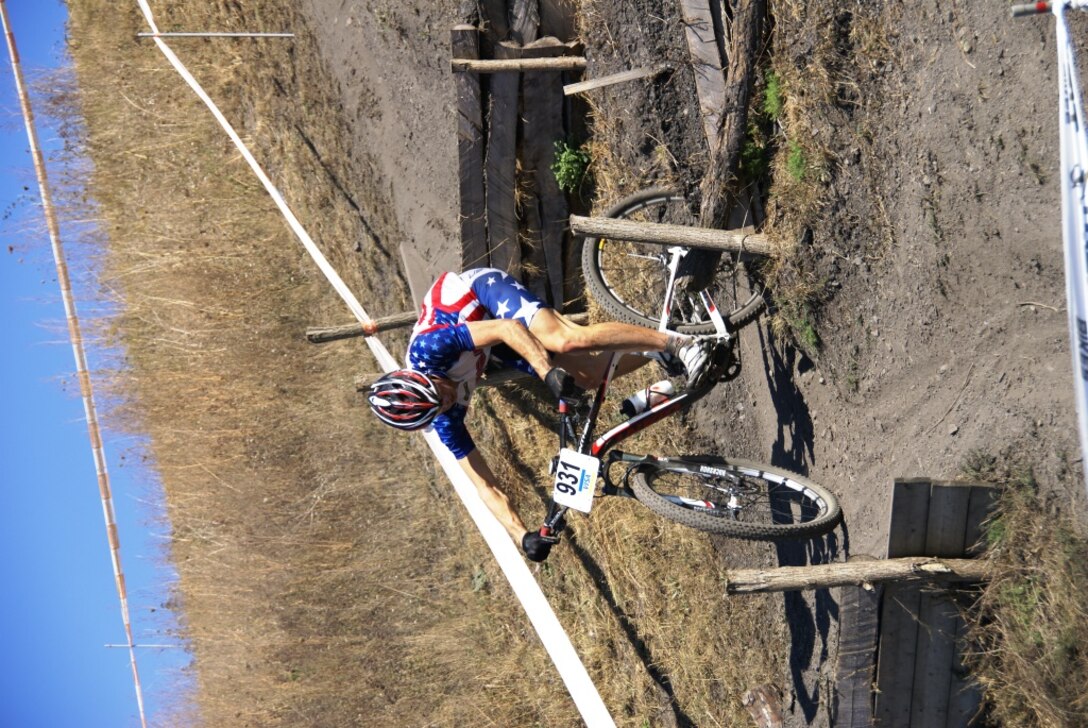 SrA Dave Flaten (USAF) works through the course of the 1st ever mountain biking race at the 2013 CISM World Military Cycling Championship 2-6 September in Leopoldsburg, Belgium.  