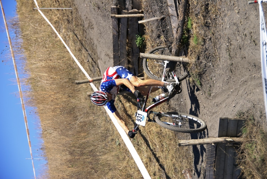 SrA Dave Flaten (USAF) works through the course of the 1st ever mountain biking race at the 2013 CISM World Military Cycling Championship 2-6 September in Leopoldsburg, Belgium.  