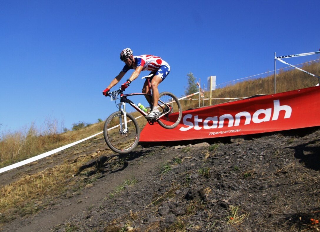 AWSI Chuck Jenkins (Navy) takes flight at the 1st ever Mountain Bike race at the 2013 CISM World Military Cycling Championship 2-6 September in Leopoldsburg, Belgium.  