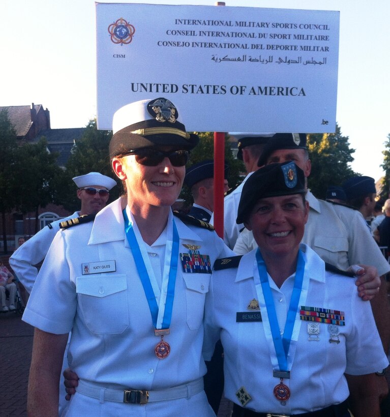 Left to right:  LCDR Katy Giles (Navy) and SGT Maatje Benassi (Army) take the women's road race bronze medal while competing in the 2013 CISM World Military Cycling Championship 2-6 September in Leopoldsburg, Belgium.  This was the first CISM championship with a separate women's team division.  