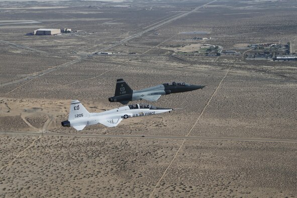 T-38 A-model and T-38 C-model are flown in formation one last time at Edwards Air Force Base, Calif., Sept. 19, 2013. (U.S. Air Force courtesty photo/Bobbi Zapka)