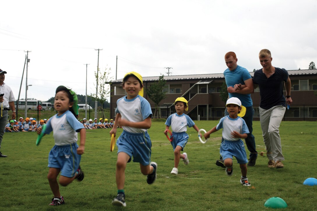 Marines race against children of the Ohira Manyo Kodomoen nursery home Sept. 11 in Miyagi prefecture, Japan. The Marines are with Battery C, 1st Battalion, 12th Marine Regiment, currently assigned to 3rd Bn., 12th Marines, 3rd Marine Division, III Marine Expeditionary Force, under the unit deployment program.