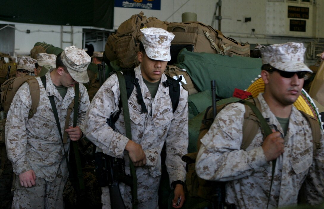 Marines with the 31st Marine Expeditionary Unit walk past a stack of bags while disembarking the USS Bonhomme Richard (LHD 6) to end their regularly scheduled Fall Patrol here, Sept. 25. The unit returned after spending nearly three months patrolling the Asia-Pacific region and conducting bilateral training exercises with the Australian Defense Forces. The 31st MEU is the only continuously forward-deployed MEU and is the Marine Corps’ force in readiness in the Asia-Pacific region. 