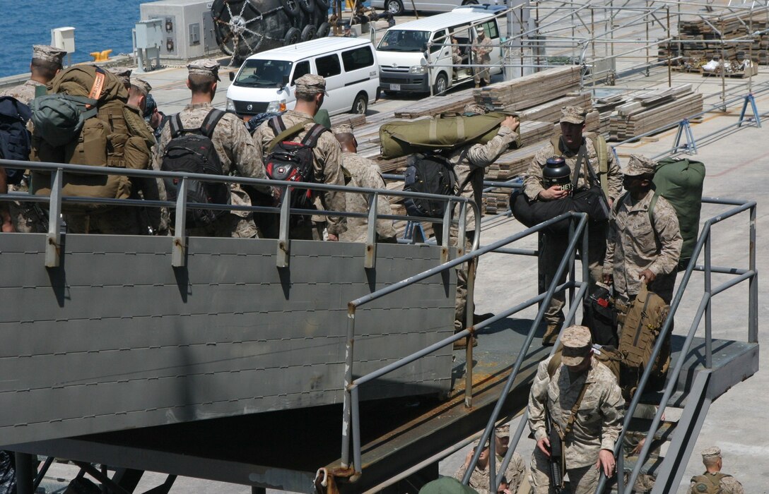 Marines and Sailors with the 31st Marine Expeditionary Unit carry bags down the stairs while disembarking the USS Bonhomme Richard (LHD 6) to end their regularly scheduled Fall Patrol here, Sept. 25. The unit returned after spending nearly three months patrolling the Asia-Pacific region and conducting bilateral training exercises with the Australian Defense Forces. The 31st MEU is the only continuously forward-deployed MEU and is the Marine Corps’ force in readiness in the Asia-Pacific region. 